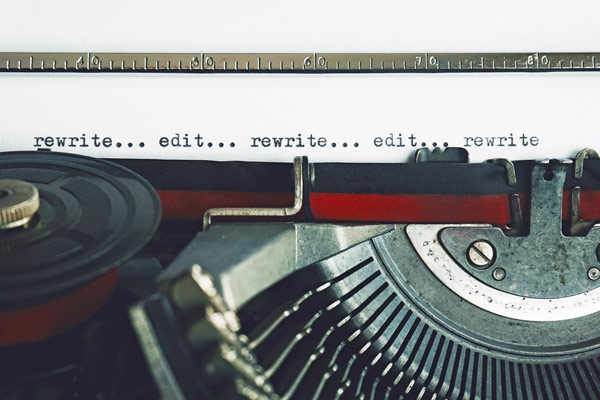 typewriter with words "rewrite" and "edit"