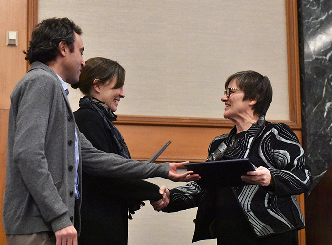 Two people accept an award at the MLA Annual Convention