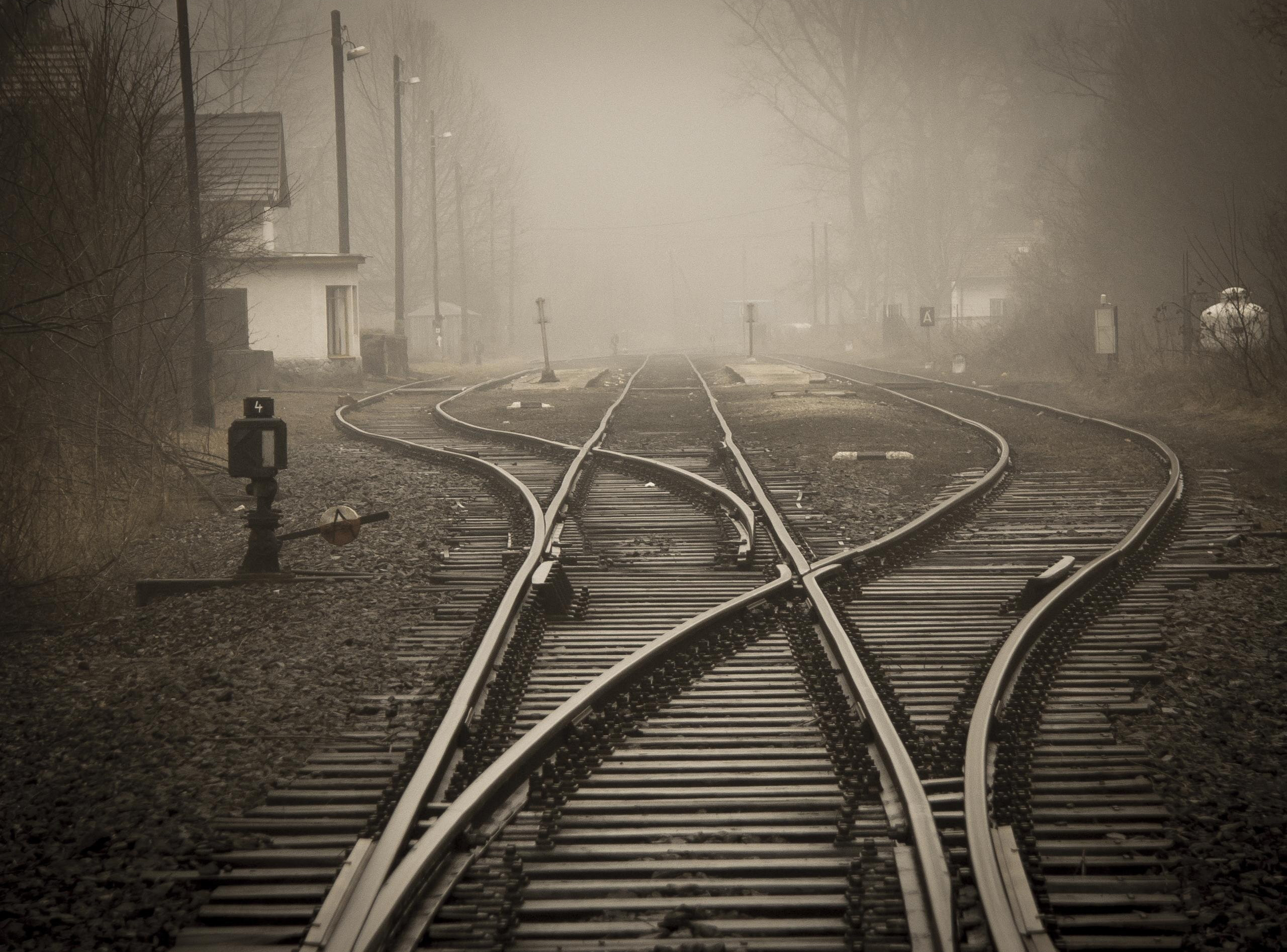 Train tracks heading into the misty distance