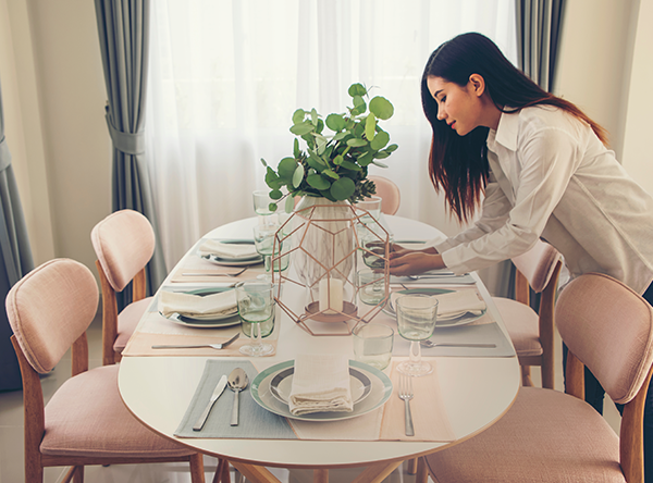 a person sets a table