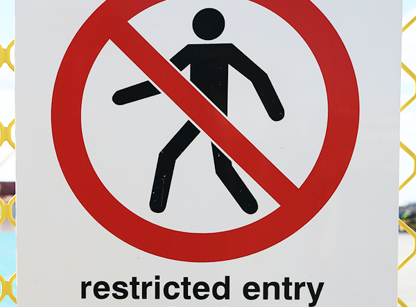 Sign reading "restricted entry"