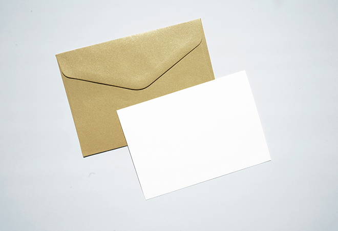 An envelope and a blank piece of paper