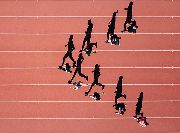 A group of people running on a track