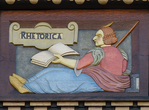 Wood carving with the word "Rhetorica"