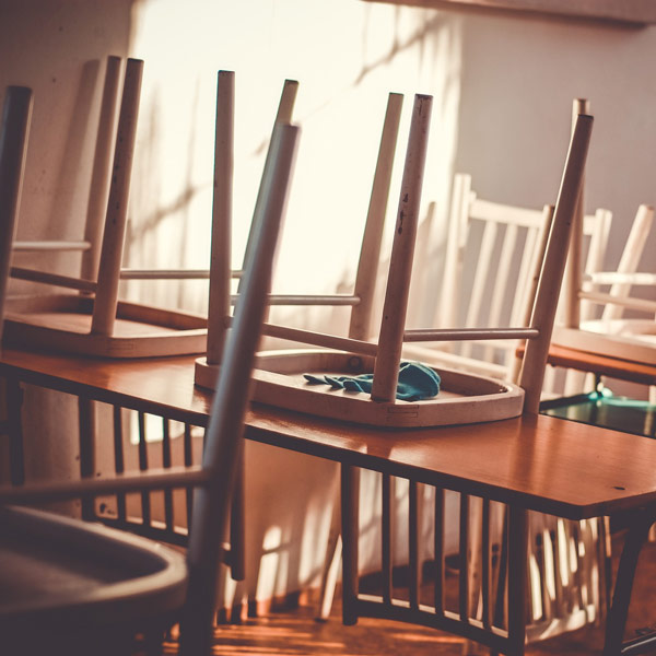 chairs on desks in classroom